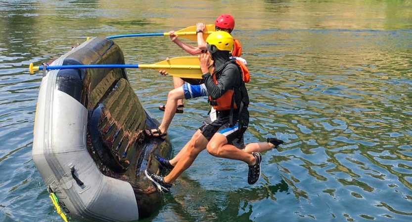outward bound students participate in a rafting exercise